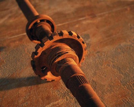 Photo for Vintage rusty drive shaft on weathered rusty metal sheet. - Royalty Free Image