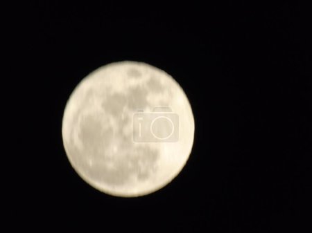 Photo for Genova, Italy-July 14, 2022: Beautifull full moon. Summer super moon with dark background behind. Moon detail in summer days. - Royalty Free Image