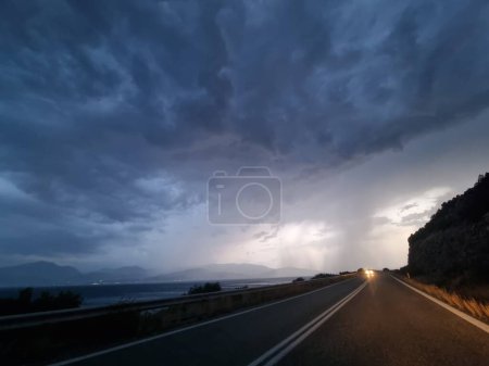 Photo for Rain road  in the evening storm bad weather travelling tornado - Royalty Free Image