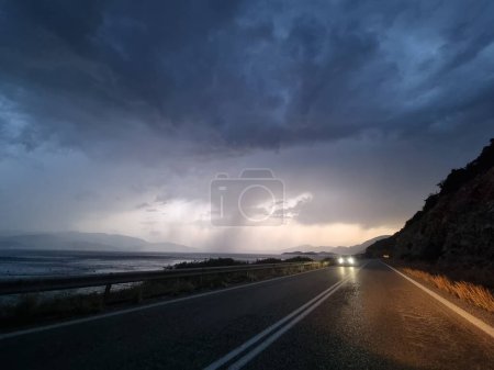 Photo for Rain road  in the evening storm bad weather travelling tornado - Royalty Free Image