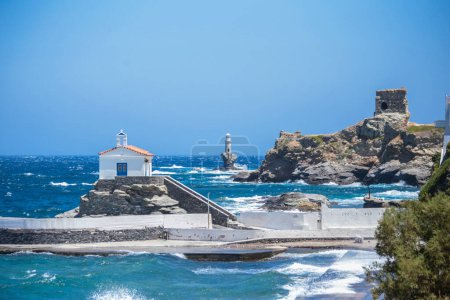 andros island greece, andros city capital of the island in windy summer day,lighthouse