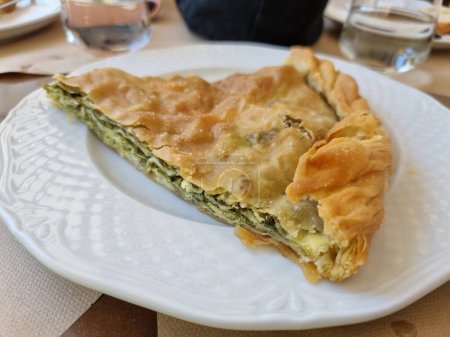 vegetable cabbage pie one slive in the plate in greece food traditional