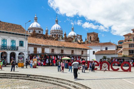 Photo for Cuenca, Ecuador - August 12, 2022: San Francisco Plaza (square) in historical center of city Cuenca, UNESCO world heritage site, city name sign "Cuenca" with view of Cathedral at background - Royalty Free Image