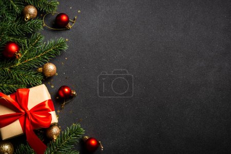 Photo for Christmas flat lay background with holiday decorations. Top view on black with copy space. - Royalty Free Image