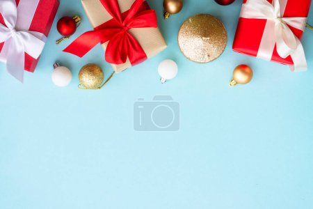 Photo for Christmas present boxes on blue background. Top view with copy space.. - Royalty Free Image