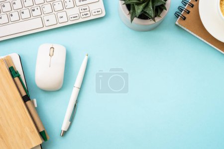 Foto de Office desk flat lay background with laptop, notepad, green plant and pen. - Imagen libre de derechos