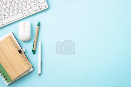 Foto de Office desk flat lay background with laptop, notepad and pen. - Imagen libre de derechos