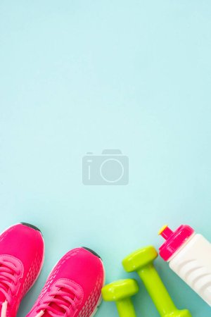 Photo for Fitness background, healthy lifestyle concept. Dumbbells, measuring tape and water bottle top view. - Royalty Free Image