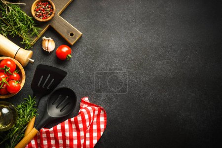 Téléchargez les photos : Ingredients for cooking. Food background. Top view on black background. - en image libre de droit