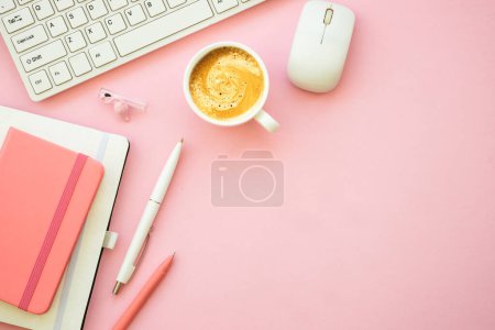 Photo for Home office workspace. Pink flat lay office desk with keyboard, notebook and coffee cup.. - Royalty Free Image