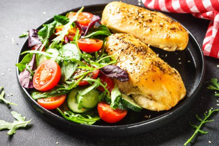 Photo for Healthy food plate, keto diet. Green salad with chicken fillet on black. - Royalty Free Image