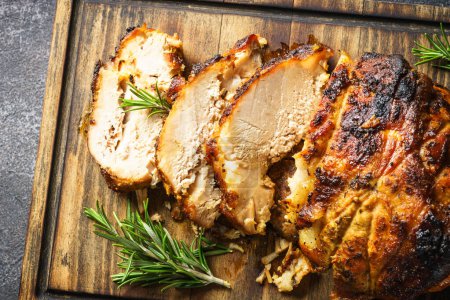 Photo for Roasted pork, baked ham on wooden cutting board. Close up image. - Royalty Free Image