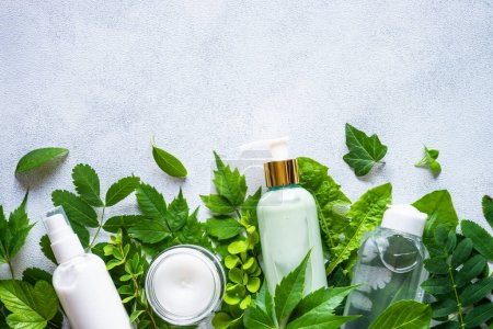 Photo for Natural cosmetics. Skin care product, cream, soap, mask with green leaves. Flat lay image on white with copy space. - Royalty Free Image