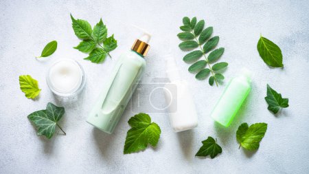 Photo for Natural cosmetic concept. Skin care product, cream, soap, tonic, mask with green plants. Flat lay image. - Royalty Free Image