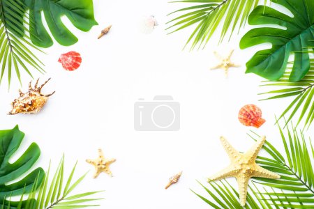 Photo for Tropical leaves and sea shells on white background. Summer flat lay background with copy space. - Royalty Free Image