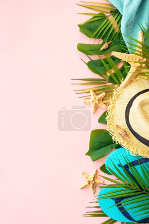 Photo for Summer holidays and travel concept. Palm leaves, sea shells, hat and flip flops on pink background. Flat lay with copy space. - Royalty Free Image