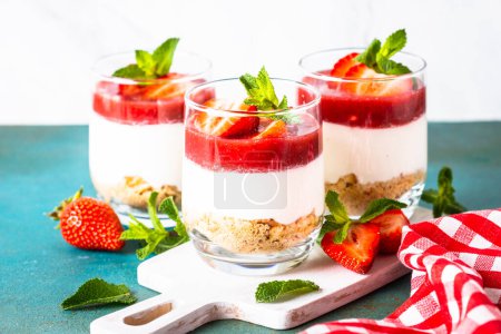 Photo for Strawberry cheesecake, tasty dessert, no baking cake in jars. - Royalty Free Image