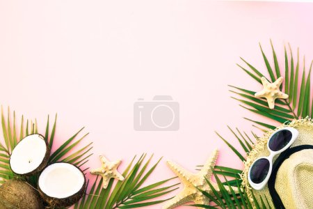Photo for Summer flat lay background. Palm leaves, coconut, hat and sea shells on pink background. - Royalty Free Image