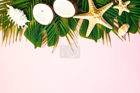 Photo for Tropical leaves, coconut and sea shells on pink background. Top view with copy space. - Royalty Free Image