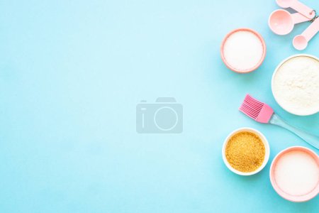 Photo for Food baking background. Ingredients for cooking at blue. Flat lay. - Royalty Free Image
