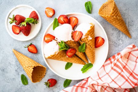 Photo for Homemade ice cream with fresh strawberries on stone table. Flat lay. - Royalty Free Image