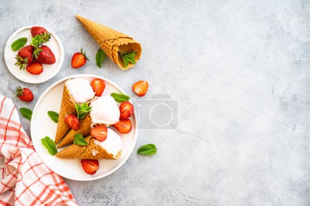 Photo for Homemade ice cream with fresh strawberries on stone table. Top view with copy space. - Royalty Free Image