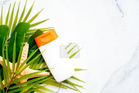Photo for Sun screen cream, palm leaves and star fish on white background. Flat lay with copy space. - Royalty Free Image