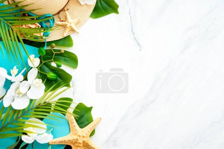 Photo for Summer vacation and travel concept. Palm leaves, hat and flip flop on white background. Flat lay with copy space. - Royalty Free Image