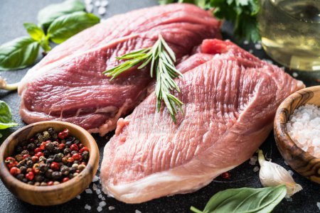 Photo for Raw meat steaks with spices and herbs. Close up. - Royalty Free Image