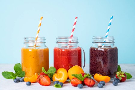 Photo for Smoothie with fresh fruits and berries. Smoothie set in jars. - Royalty Free Image