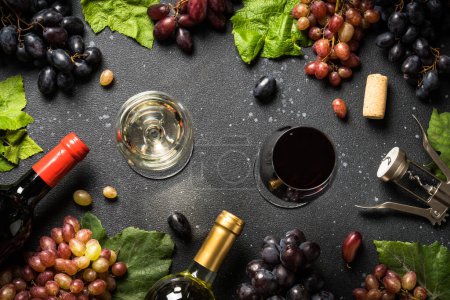 Photo for Wine set at black background. White and red wine, Glass of wine, bottle and fresh crape. Top view with copy space. - Royalty Free Image