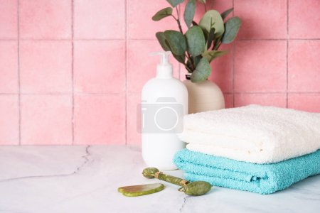 Photo for Clean towels and cosmetic products in the bathroom. - Royalty Free Image
