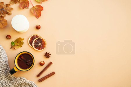 Photo for Autumn flat lay background. Hot tea, spices, orange leaves, and home decor. - Royalty Free Image