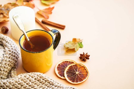Photo for Autumn background. Hot tea, spices, orange leaves, and home decor. - Royalty Free Image