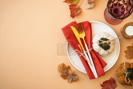 Photo for Thanksgiving table top view on color background. White plate, cutlery and autumn decorations. - Royalty Free Image