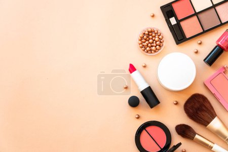 Photo for Autumn beauty background. Cosmetic bag with make-up beauty products and autumn leaves at pastel background. Flat lay with space for text. - Royalty Free Image