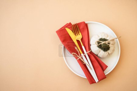 Photo for White plate, cutlery and autumn decorations. Top view. - Royalty Free Image