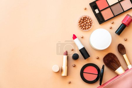 Photo for Cosmetic bag with beauty products at pastel background. Powder, foundation, mascara, lipsticks. Flat lay with copy space. - Royalty Free Image