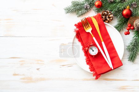 Photo for Christmas table with holiday food background. White plate and decorations top view. - Royalty Free Image
