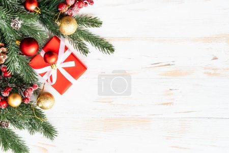 Photo for Christmas Present box and red decorations on white background. Flat lay with copy space. - Royalty Free Image