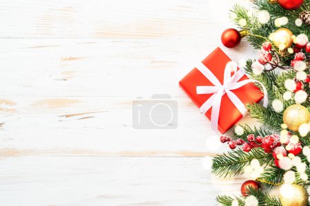 Photo for Christmas background with light effect. Present box and christmas decorations. Flat lay on white with copy space. - Royalty Free Image