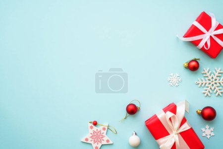 Photo for Christmas background. Christmas present boxes and holiday decorations at blue. Flat lay image with copy space. - Royalty Free Image