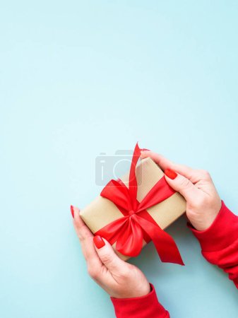 Photo for Boxing day, christmas present. Woman giving christmas present. Top view image. - Royalty Free Image