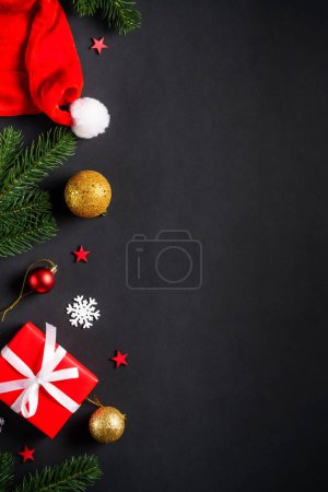 Photo for Black christmas flat lay background. Christmas fir tree with presents and holidays decorations. - Royalty Free Image