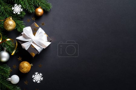 Photo for Christmas background with christmas tree, present box and holidays decorations. Flat lay image with copy space. - Royalty Free Image