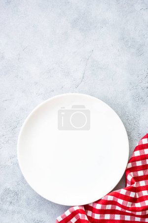 Photo for White plate and napkin at stone table. Table setting, Flat lay image. - Royalty Free Image
