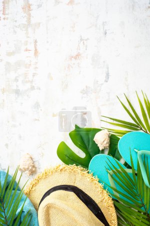 Photo for Summer flat lay background, vacation and travel concept. Palm leaves, hat, flip flop and sunglasses on white. - Royalty Free Image