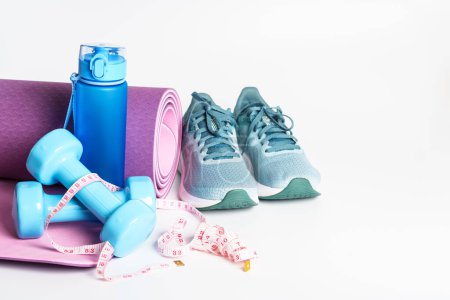 Photo for Yoga mat, sneakers, dumbbells and bottle of water isolated on white background. Sport equipment. - Royalty Free Image