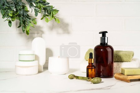 Photo for Bath background, beauty products in the bath shielf on white background. Cream, mask, soap, jade roller and face serum. - Royalty Free Image