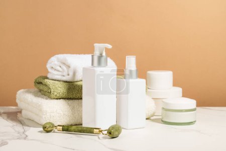 Photo for Spa products in the bathroom. Shampoo, cream, towels. Natural cosmetic background. - Royalty Free Image